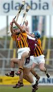 27 February 2005; Brian Barry and Martin Comerford, right, Kilkenny, in action against David Collins, and Ger Farragher, hidden, Galway. Allianz National Hurling League, Division 1A, Kilkenny v Galway, Nowlan Park, Kilkenny. Picture credit; Pat Murphy / SPORTSFILE