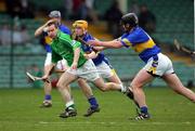 27 February 2005; Donie Ryan, Limerick, in action against Eamonn Corcoran and David Kennedy, Tipperary. Allianz National Hurling League, Division 1B, Limerick v Tipperary, Gaelic Grounds, Limerick. Picture credit; Kieran Clancy / SPORTSFILE