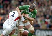 27 February 2005; Paul O'Connell, Ireland, is tackled by Steve Thompson (2) and Matt Stevens, England. RBS Six Nations Championship 2005, Ireland v England, Lansdowne Road, Dublin. Picture credit; Brendan Moran / SPORTSFILE