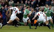 27 February 2005; Brian O'Driscoll, Ireland, is tackled by Olly Barkley (12) and Jamie Noon (13), England. RBS Six Nations Championship 2005, Ireland v England, Lansdowne Road, Dublin. Picture credit; Brendan Moran / SPORTSFILE