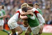 27 February 2005; Paul O'Connell, Ireland, is tackled by Lewis Moody, left, and Joe Worsley, England. RBS Six Nations Championship 2005, Ireland v England, Lansdowne Road, Dublin. Picture credit; Brendan Moran / SPORTSFILE