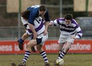 28 February 2005; Darren Hudson, St. Mary's College, is tackled by Michael Sheehy and Joe Ryan, right, Clongowes Wood. Leinster Schools Junior Cup Quarter-Final, Clongowes Wood College v St. Mary's, Donny Brook, Dublin. Picture credit; Ciara Lyster / SPORTSFILE