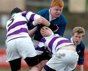 28 February 2005; Neil Murphy, St. Mary's College, is tackled by Matthew Collins, left and Tim O'Mahony, Clongowes Wood. Leinster Schools Junior Cup Quarter-Final, Clongowes Wood College v St. Mary's, Donny Brook, Dublin. Picture credit; Pat Murphy / SPORTSFILE