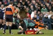 27 February 2005; Paul O'Connell, Ireland, is attended to by team doctor Gary O'Driscoll. RBS Six Nations Championship 2005, Ireland v England, Lansdowne Road, Dublin. Picture credit; Brendan Moran / SPORTSFILE