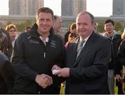 30 November 2013; Brian Gavin, linesman, is presented with a medal by Uachtarán Chumann Lúthchleas Gael Liam Ó Néill after the game. GAA GPA All-Stars 2013 Exhibition Match, GAA GPA All-Stars 2013 v GAA GPA All-Stars 2012, Sponsored by Opel, Shanghai Rugby Football Club, Zhangyang Bei Lu, Wuzhou Da Dao, Shanghai, China. Picture credit: Ray McManus / SPORTSFILE