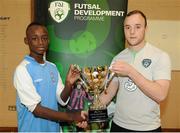4 December 2013; Tony Mambouna, Limerick C.B.S, is presented with the trophy by Micheál Schlingermann. FAI All-Ireland Post Primary Schools First Year Futsal Finals, Franciscan College, Sports Centre, Gormanston, Co. Meath. Picture credit: Ramsey Cardy / SPORTSFILE