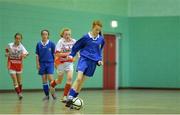4 December 2013; Alana Doherty, Scoil Mhuire, in action against Laura Hayes, Loreto Secondary School, Fermoy. FAI All-Ireland Post Primary Schools First Year Futsal Finals, Franciscan College, Sports Centre, Gormanston, Co. Meath. Picture credit: Ramsey Cardy / SPORTSFILE