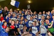 1 December 2013; The Ballinderry Shamrocks squad celebrate with the Seamus McFerran Cup. AIB Ulster Senior Club Football Championship Final, Glenswilly, Donegal v Ballinderry Shamrocks, Derry, Healy Park, Omagh, Co. Tyrone. Picture credit: Oliver McVeigh / SPORTSFILE