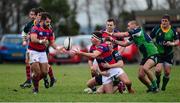 7 December 2013; Adrian D'Arcy, Clontarf, passes the ball to team-mate Cian Culleton as he is tackled by Neil Faloon, Ballinahinch. Ulster Bank League, Division 1A, Ballinahinch v Clontarf, Ballymacarn Park, Ballinahinch, Co. Antrim. Picture credit: Oliver McVeigh / SPORTSFILE
