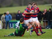 7 December 2013; Adrian D'Arcy, Clontarf, is tackled by Michael Cromie, Ballinahinch. Ulster Bank League, Division 1A, Ballinahinch v Clontarf, Ballymacarn Park, Ballinahinch, Co. Antrim. Picture credit: Oliver McVeigh / SPORTSFILE