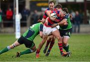 7 December 2013; Anthony Ryan, Clontarf, is tackled by John Madden, left, and Michael Cromie, Ballinahinch. Ulster Bank League, Division 1A, Ballinahinch v Clontarf, Ballymacarn Park, Ballinahinch, Co. Antrim. Picture credit: Oliver McVeigh / SPORTSFILE