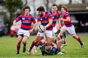 7 December 2013; Adrian D'Arcy, Clontarf, passes the ball to Cian Culleton as he is tackled by Neil Faloon, Ballinahinch. Ulster Bank League, Division 1A, Ballinahinch v Clontarf, Ballymacarn Park, Ballinahinch, Co. Antrim. Picture credit: Oliver McVeigh / SPORTSFILE