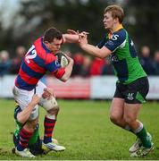 7 December 2013; Killian Lett, Clontarf, is tackled by Harry McAleese and Jordan Gratton, Ballinahinch. Ulster Bank League, Division 1A, Ballinahinch v Clontarf, Ballymacarn Park, Ballinahinch, Co. Antrim. Picture credit: Oliver McVeigh / SPORTSFILE
