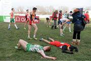 8 December 2013; Ireland's Sean Tobin and Denmark's Anders Lund Hansen lie on the ground after finishing the Men's Junior Race during the Spar European Cross Country Championships 2013. Friendship Park, Belgrade, Serbia. Picture credit: Brendan Moran / SPORTSFILE
