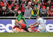 8 December 2013; Keith Earls, Munster, goes over to score his side's third try, despite the tackle of James Hook, Perpignan. Heineken Cup 2013/14, Pool 6, Round 3, Munster v Perpignan, Thomond Park, Limerick. Picture credit: Diarmuid Greene / SPORTSFILE