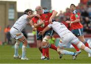 8 December 2013; Paul O'Connell, Munster, is tackled by Jean-Pierre Perez, left, and Luke Charteris, Perpignan. Heineken Cup 2013/14, Pool 6, Round 3, Munster v Perpignan, Thomond Park, Limerick. Picture credit: Diarmuid Greene / SPORTSFILE