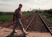 15th May 1998; Brian Waites walks across the railway tracks between the 17th and 18th holes during the AIB Irish Seniors Open at Woodbrook Golf Club in Wicklow. Photo by David Maher/Sportsfile