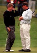 4 July 1997; Colin Montgomerie, left, of Scotland in conversation with Darren Clarke of Northern Ireland on the 18th green during the second round of the Murphy's Irish Open Golf Championship at Druid's Glen Golf Club in Wicklow. Photo by Brendan Moran/Sportsfile