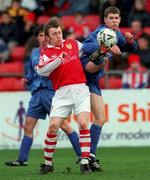 7 February 1999; Eamon McLoughlin of UCD in action against Trevor Molloy of St Patrick's Athletic during the Harp Larger FAI Cup Second Round match between St Patrick's Athletic and UCD at Richmond Park in Dublin. Photo by Damien Eagers/Sportsfile