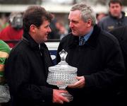 24 January 1999, An Taoiseach Bertie Ahern TD presents owner JP McManus with the trophy after he sent out Istabraq to win the AIG Europe Champion Hurdle at Leopardstown Racecourse in Dublin. Photo by Ray McManus/Sportsfile
