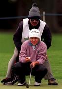 27 June 1997; Jane Leary of Australia lines up a putt, with the assistance of her caddy and husband Don, during the second round of the Guardian Ladies Irish Open at Luttrellstown Castle Golf Club in Dublin. Photo by David Maher/Sportsfile