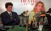 29 April 1998; Michelle Smith de Bruin, reading a prepared statement, accompanied by her husband and coach Eirk de Bruin, during a press conference at Lennon Heather & Company Solicitors in Dublin. Photo by Brendan Moran/Sportsfile