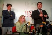 29 April 1998; Michelle Smith de Bruin accompanied by her husband and coach Eirk de Bruin, left, and solicitor Peter Lennon, right, during a press conference at Lennon Heather & Company Solicitors in Dublin. Photo by Brendan Moran/Sportsfile