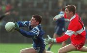 14 February 1999; Padraig McKenna of Monaghan in action against Joseph Cassidy of Derry during the Church and General National Football League Division 1 match between Derry and Monaghan at Celtic Park in Derry. Photo by Ray Lohan/Sportsfile