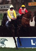 9 January 1999; Lord Heavens, with Ruby Walsh up, jumps the last, first time around, ahead of Roundwood, with Garrett Cotter up, during the Pierse Leopardstown Handicap Steeplechase at at Leopardstown Racecourse in Dublin. Photo by Aoife Rice/Sportsfile