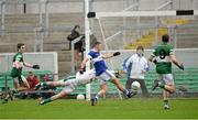 8 December 2013; Shane Carthy, St.Vincents, beats Portlaoise goalkeeper Michael Nolan to score his side's third goal. AIB Leinster Senior Club Football Championship Final, Portlaoise, Laois v St Vincent's, Dublin, O'Connor Park, Tullamore, Co. Offaly. Picture credit: David Maher / SPORTSFILE