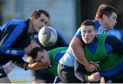 9 December 2013; Leinster's John Cooney is tackled by Jack McGrath as team-mates Devin Toner, left, and Zane Kirchner watch on during squad training ahead of their Heineken Cup 2013/14, Pool 1, Round 4, match against Northampton on Saturday. Leinster Rugby Squad Training & Press Briefing, UCD, Belfield, Dublin. Picture credit: Stephen McCarthy / SPORTSFILE