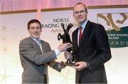 9 December 2013; Jockey Johnny Murtagh, left, is presented with his Flat Award by Simon Coveney T.D, Minister for Agriculture, Food and the Marine. Horse Racing Ireland Awards, The Pavilion, Leopardstown Racecourse, Leopardstown, Co. Dublin. Picture credit: David Maher / SPORTSFILE