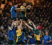7 December 2013; Courtney Lawes, Northampton Saints, claims possession in a lineout ahead of Mike McCarthy, Leinster. Heineken Cup 2013/14, Pool 1, Round 3, Northampton Saints v Leinster. Franklins Gardens, Northampton, England. Picture credit: Stephen McCarthy / SPORTSFILE