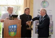 10 December 2013; The Irish Universities Football Union Centenary Collingwood Cup will be hosted by UCD AFC in 2014 and will take place from Tuesday 24th February to Friday 28th February at the UCD Campus, Belfield, Dublin. Making the draw is Paddy McCaul, right, President of the FAI, assisted by Denis Clarke, left, and John McCarthy of the IUFU. Newman House, Dublin. Picture credit: Brendan Moran / SPORTSFILE
