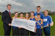 11 December 2013; Liberty Insurance, proud partner of both Hurling and Camogie today announced that Sixmilebridge GAA club have won €10,000 through the Liberty Insurance GAA club offer. Liberty Insurance has extended its club offer until March 2014 allowing new customers that take out a home or motor policy with Liberty Insurance to nominate their local GAA club to receive €50. For more information visit www.libertygaa.ie. Pictured with Liberty Insurance Marketing Executive Joe Canning are Sixmilebridge players  Niall Gilligan and Chloe Morey along with sixth class students from Sixmilebridge Primary School, from left, Rachel Murray, Matthew Dillon, Storm Devanney, Cliona Donnellan and Brian Flynn. Sixmilebridge GAA, Co. Clare. Picture credit: Diarmuid Greene / SPORTSFILE