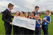 11 December 2013; Liberty Insurance, proud partner of both Hurling and Camogie today announced that Sixmilebridge GAA club have won €10,000 through the Liberty Insurance GAA club offer. Liberty Insurance has extended its club offer until March 2014 allowing new customers that take out a home or motor policy with Liberty Insurance to nominate their local GAA club to receive €50. For more information visit www.libertygaa.ie. Pictured with Liberty Insurance Marketing Executive Joe Canning are Sixmilebridge players Chloe Morey and Niall Gilligan along with sixth class students from Sixmilebridge Primary School, from left, Rachel Murray, Matthew Dillon, Storm Devanney, Cliona Donnellan and Brian Flynn. Sixmilebridge GAA, Co. Clare. Picture credit: Diarmuid Greene / SPORTSFILE