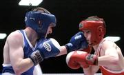 11 March 2005; Jimmy Moore, red, St. Francis, Limerick, in action against Patrick Barnes, Holy Family. National Senior Boxing Championships Semi-Finals, 48kg Light Flyweight, Jimmy Moore.v.Patrick Barnes, National Stadium, South Circular Road, Dublin. Picture credit; Brian Lawless / SPORTSFILE