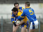 12 March 2005; Michael O'Dwyer, Clare, in action against Arthur O'Connor, and Shane Mulligan, 5, Longford. Allianz National Football League, Division 2A, Clare v Longford, Cusack Park, Ennis, Co. Clare. Picture credit; Ray McManus / SPORTSFILE