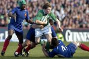 12 March 2005; Brian O'Driscoll, Ireland, is tackled by Serge Betsen, left, Sylvain Marconnet and Fabien Pelous, 4, France. RBS Six Nations Championship 2005, Ireland v France, Lansdowne Road, Dublin. Picture credit; Matt Browne / SPORTSFILE