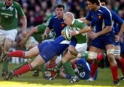 12 March 2005; Peter Stringer, Ireland, is tackled by Cedric Haymans and Fabien Pelous, right, France. RBS Six Nations Championship 2005, Ireland v France, Lansdowne Road, Dublin. Picture credit; Brendan Moran / SPORTSFILE