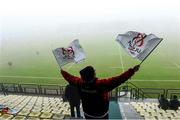 14 December 2013; An Ulster fan in the stand during the fog affected game. Heineken Cup 2013/14, Pool 5, Round 4, Benetton Treviso v Ulster. Stadio Comunale di Monigo, Treviso, Italy. Picture credit: Oliver McVeigh / SPORTSFILE