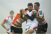 14 December 2013; Jared Payne, Ulster, is tackled by Robert Barbieri and Edoardo Gori, Benetton Treviso. Heineken Cup 2013/14, Pool 5, Round 4, Benetton Treviso v Ulster. Stadio Comunale di Monigo, Treviso, Italy. Picture credit: Oliver McVeigh / SPORTSFILE