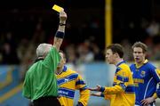 12 March 2005; Kevin Dilleen, Clare, is shown the yellow card by referee Padraig Seoige. Allianz National Football League, Division 2A, Clare v Longford, Cusack Park, Ennis, Co. Clare. Picture credit; Ray McManus / SPORTSFILE