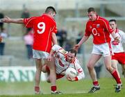 13 March 2005; Brian Meenan, Tyrone, in action against  Nickolas Murphy and Derek Kavanagh, Cork. Allianz National Football League, Division 1A, Cork v Tyrone, Pairc Ui Rinn, Cork. Picture credit; Oliver McVeigh  / SPORTSFILE