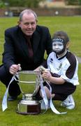 14 March 2005; Padraig Corkery, head of sporsorship eircom, with Orla O'Reilly, age 7, from Newbridge, Co. Kildare, wearing the Kildare County colours at the launch of the 2005 eircom League season. Coach House, Dublin Castle, Dublin. Picture credit; David Maher / SPORTSFILE