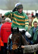 15 March 2005; John Thomas Mcnamara, aboard his mount Spot The Difference, salutes the crowd after winning the Sporting Index Handicap Steeplechase. Cheltenham Festival, Prestbury Park, Cheltenham, England. Picture credit; Pat Murphy / SPORTSFILE
