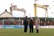 15 March 2005; Longford Town manager Alan Mathews, right, with his assistants Arron O'Callagahan, left, and Noel White view the Oval pitch with Harland and Wolff shipyard in the background. Setanta Cup 2005, Group 1, Glentoran v Longford Town, The Oval, Belfast. Picture credit; David Maher / SPORTSFILE