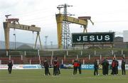 15 March 2005; Longford Town players inspect the Oval pitch before the start of the game. The Harland and Wolff shipyard is in the background. Setanta Cup 2005, Group 1, Glentoran v Longford Town, The Oval, Belfast. Picture credit; David Maher / SPORTSFILE