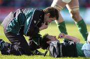 12 March 2005; Geordan Murphy, Ireland, is attended to by Cameron Steele after receiving a knock. RBS Six Nations Championship 2005, Ireland v France, Lansdowne Road, Dublin. Picture credit; Brendan Moran / SPORTSFILE