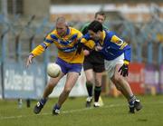 12 March 2005; David Russell, Clare, is tackled by Arthur O'Connor, Longford. Allianz National Football League, Division 2A, Clare v Longford, Cusack Park, Ennis, Co. Clare. Picture credit; Ray McManus / SPORTSFILE